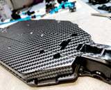 Carbon Fiber pre-cut vinyl RC Car Paint Mask used on a Tamiya TT02 Chassis
