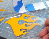 Fatty Flames RC Car pre-cut vinyl Paint Mask with included Transfer Tape being installed in a Lexan body shell