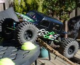 Custom Axial paintjob using xxx main Flame Strings pre-cut vinyl Paint Masks outside on a backyard crawler course.