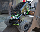 Axial RC Crawler painted black with Flame Strings vinyl masking stencils in white and green.