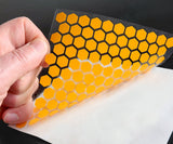 Included transfer tape being used to hold small vinyl pieces of Paint Mask together while installing.