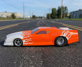 Custom painted RC Drag racing body shell using Spikes vinyl paint masks in orange and white.