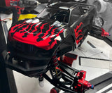 Spikes pre-cut vinyl paint masking decals used to custom paint a Traxxas Maxx black and red.