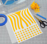 Stars and Stripes pre-cut vinyl paint masks weeded and reading to be installed into an rc car body.