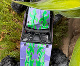 Axial RC Crawler with a custom Tribal Stripes paintjob using xxx main pre-cut vinyl Paint Masking Stencils.