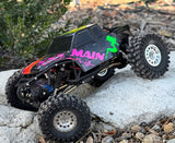 Axial RC Crawler custom painted with pre-cut vinyl Paint Masks trucker Girlie design.