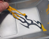 Wicked Flames pre-cut vinyl paint masks being removed from a Lexan body exposing ultra crisp paint lines.
